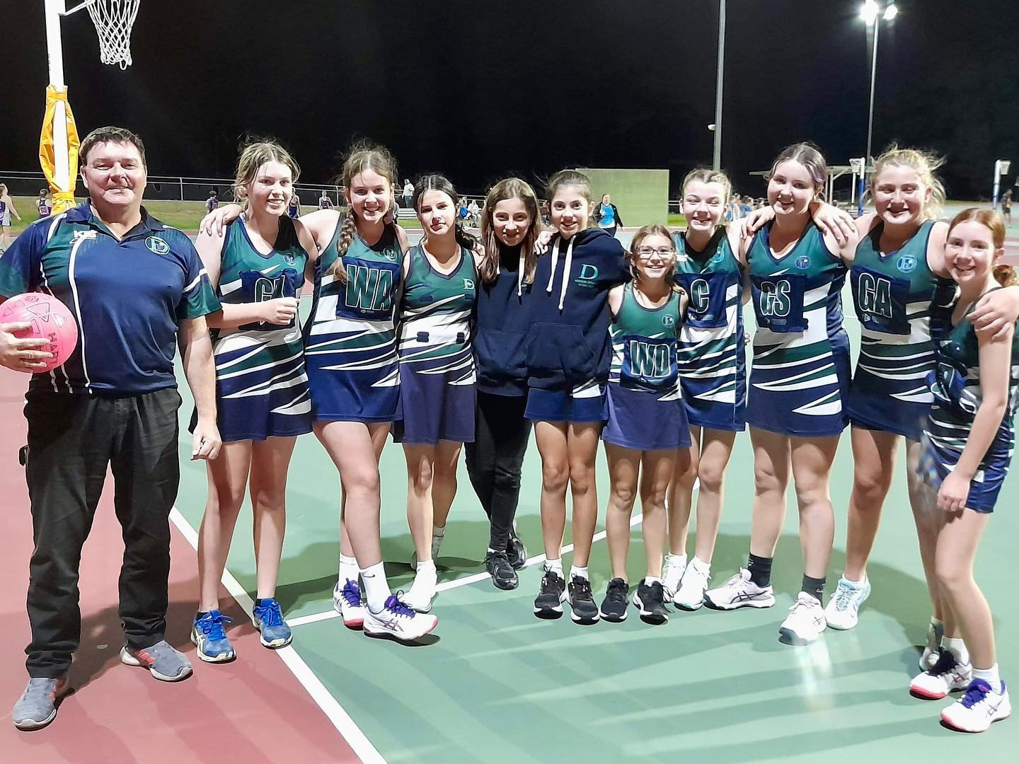 Narangba Dynamos netball team with coach